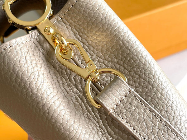 CAPUCINES MINI 21 DARK BEIGE TAURILLON GOLD HARDWARE