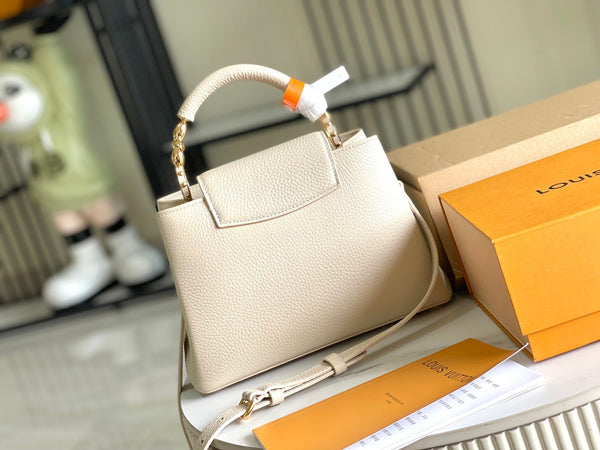 CAPUCINES MINI 21 BEIGE TAURILLON GOLD HARDWARE