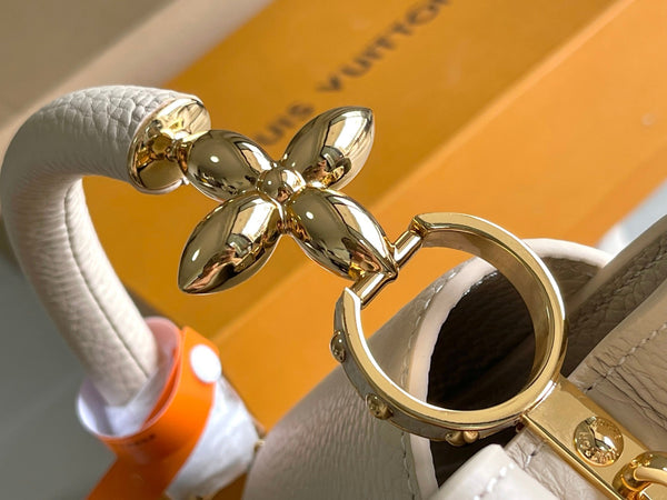 CAPUCINES MINI 21 BEIGE TAURILLON GOLD HARDWARE