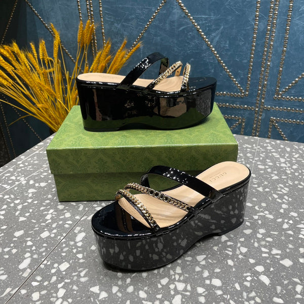 HIGH WEDGE PLATFORM IN BLACK CALFSKIN WITH GOLD HARDWARE