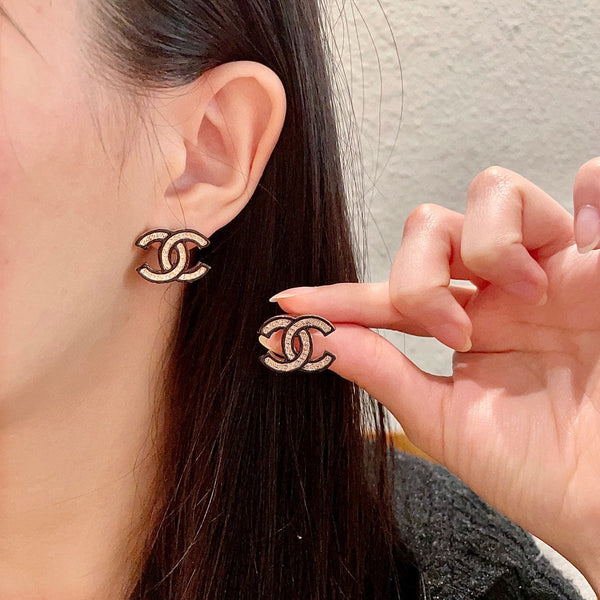 DOUBLE C STUD EARRINGS IN SILVER METAL WITH BLACK OUTLINE AND CRYSTALS INSIDE