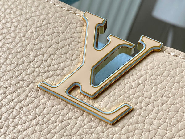 capucines bb 27 beige cloud blue taurillon leather gold hardware