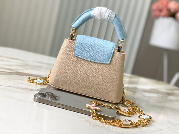capucines nano 16 beige cloud blue taurrilon leather gold hardware