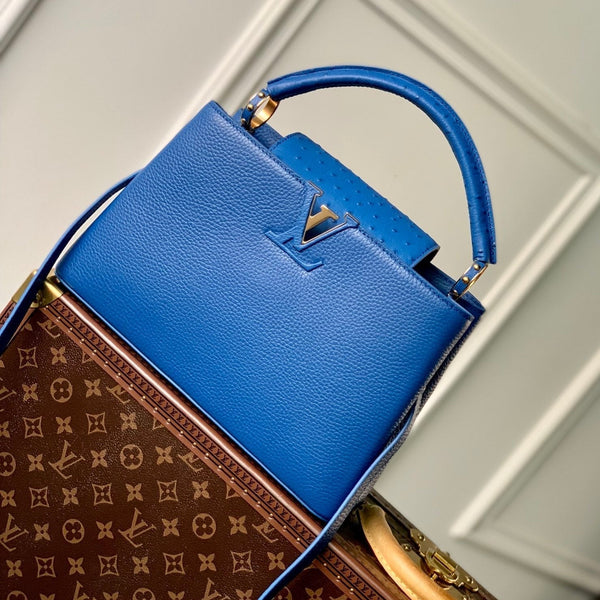 capucines mm 31.5 cobalt blue taurillon leather gold hardware