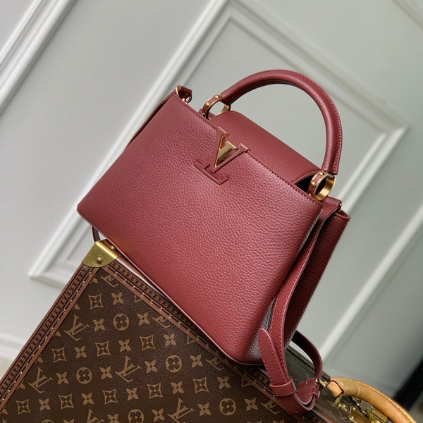 capucines mm 31.5 burgundy taurillon leather gold hardware