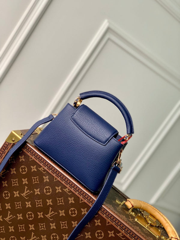 CAPUCINES MINI 21 DARK BLUE TAURILLON GOLD HARDWARE
