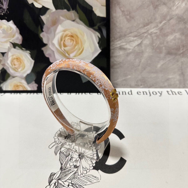 HEADBAND WITH GARNITURE PRINT IN TIGER EYE ORANGE SILK 432822