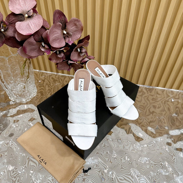 ALAIA ELASTIC CAGE MULE SANDALS IN WHITE WOVEN STRAP AND LAMBSKIN
