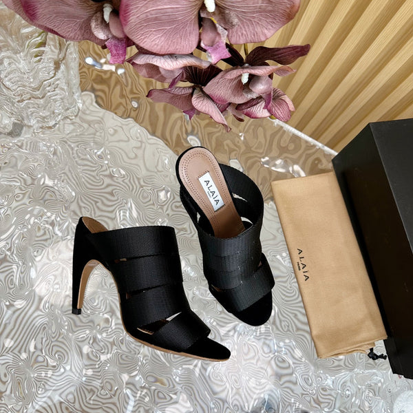 ALAIA ELASTIC CAGE MULE SANDALS IN BLACK WOVEN STRAP AND LAMBSKIN