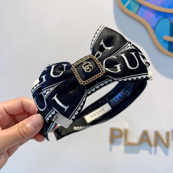 BOW HAIRBAND IN BLACK MIX WHITE RESIN AND FABRIC 432749