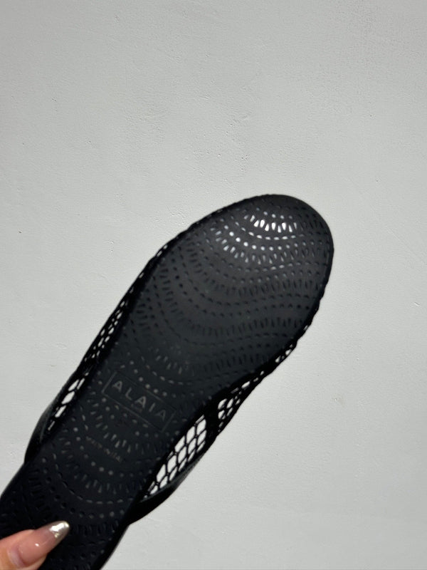 ALAIA FLAT MULES IN BLACK MESH FISHNET