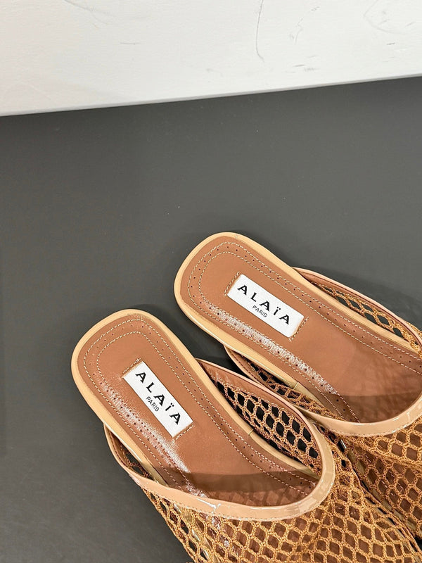 ALAIA FLAT MULES IN COPPER BROWN MESH FISHNET