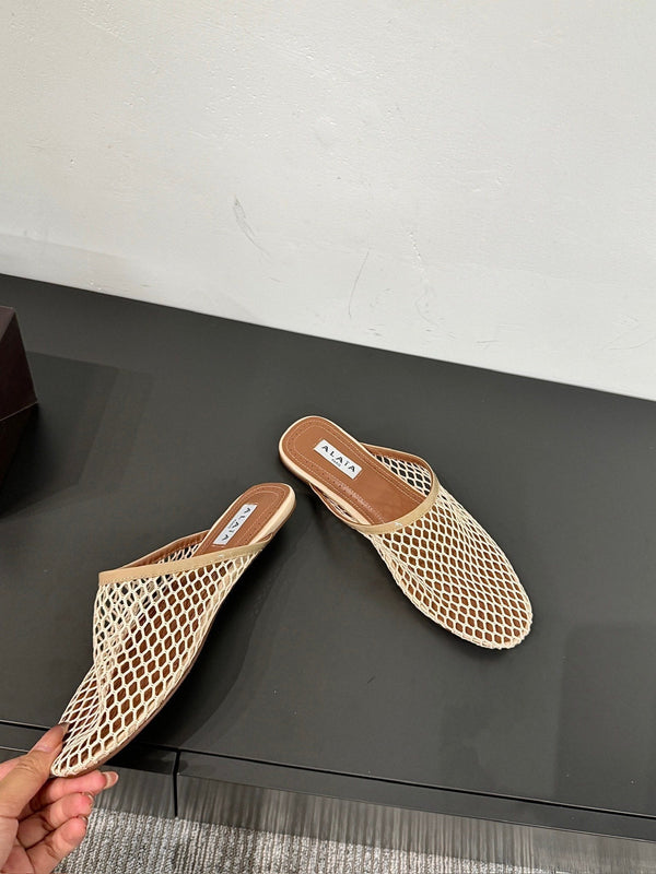 ALAIA FLAT MULES IN BEIGE MESH FISHNET