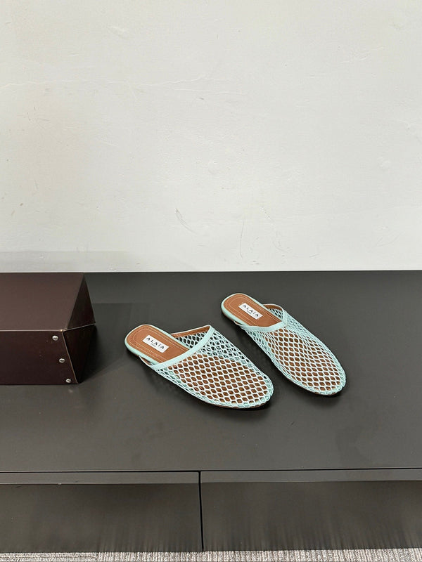 ALAIA FLAT MULES IN LIGHT BLUE MESH FISHNET