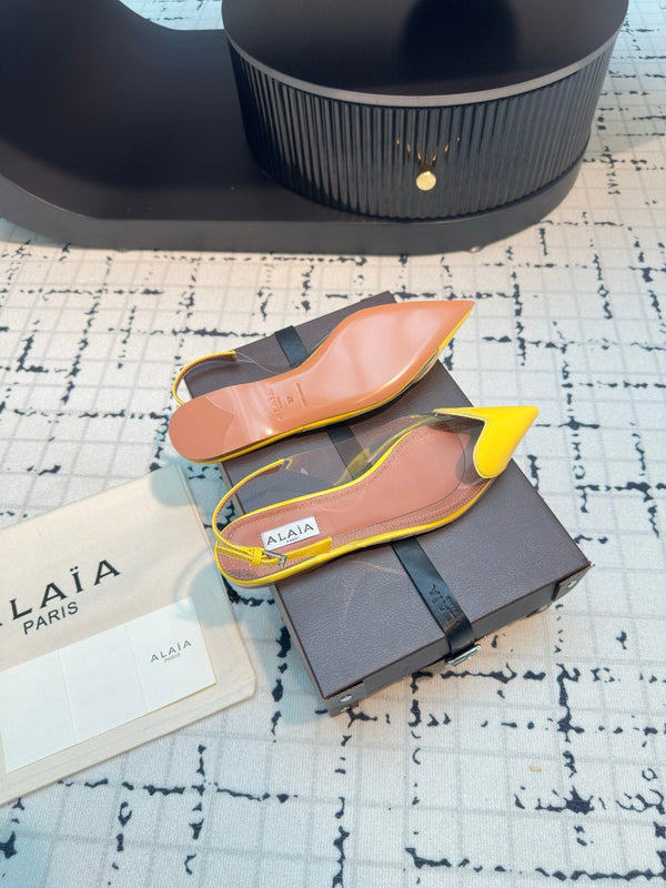 ALAIA FLAT SLINGBACK IN YELLOW PATENT CALFSKIN AND FILM