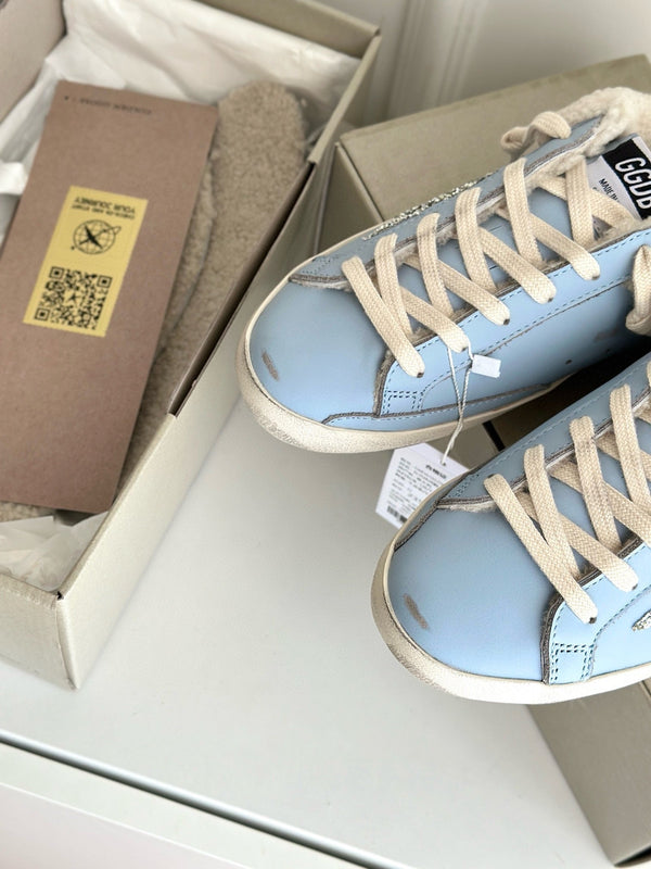 SUPER-STAR SABOTS IN BLUE CALFSKIN WITH GLITTER WHITE STAR