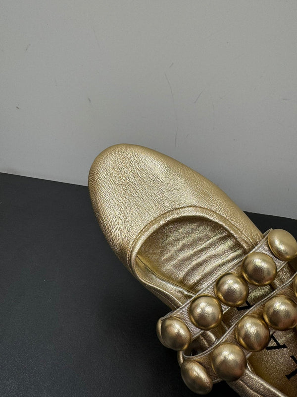ALAIA SPHERE BALLET FLATS IN GOLDEN LAMBSKIN