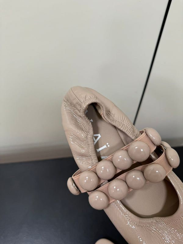 BALLERINE ALAIA SPHERE IN PELLE DI AGNELLO BEIGE MANDORLA