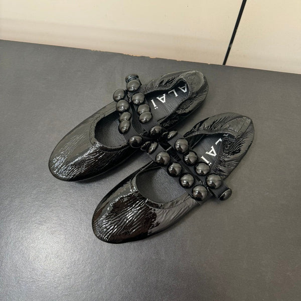 ALAIA SPHERE BALLET FLATS IN BLACK LAMBSKIN