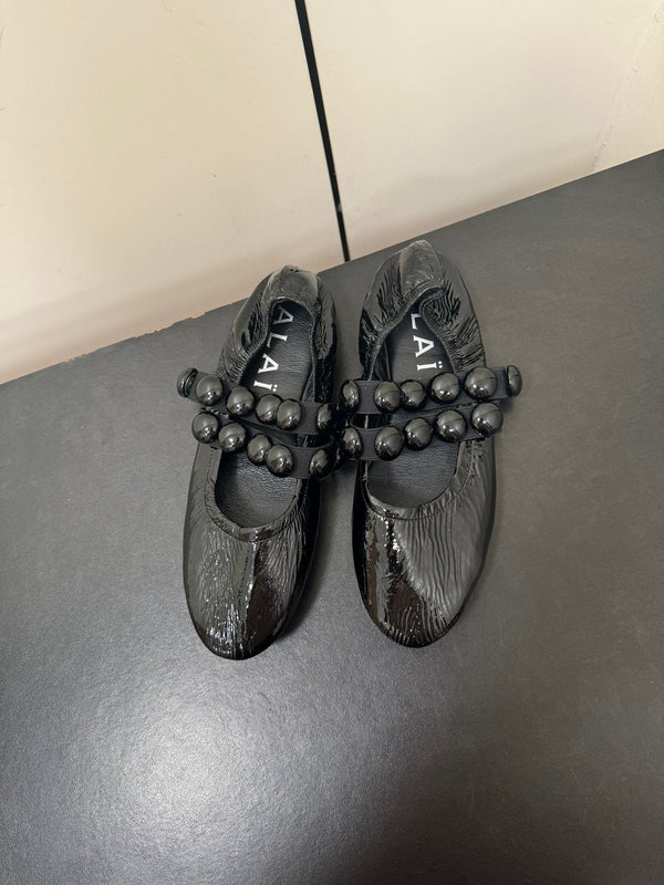 ALAIA SPHERE BALLET FLATS IN BLACK LAMBSKIN