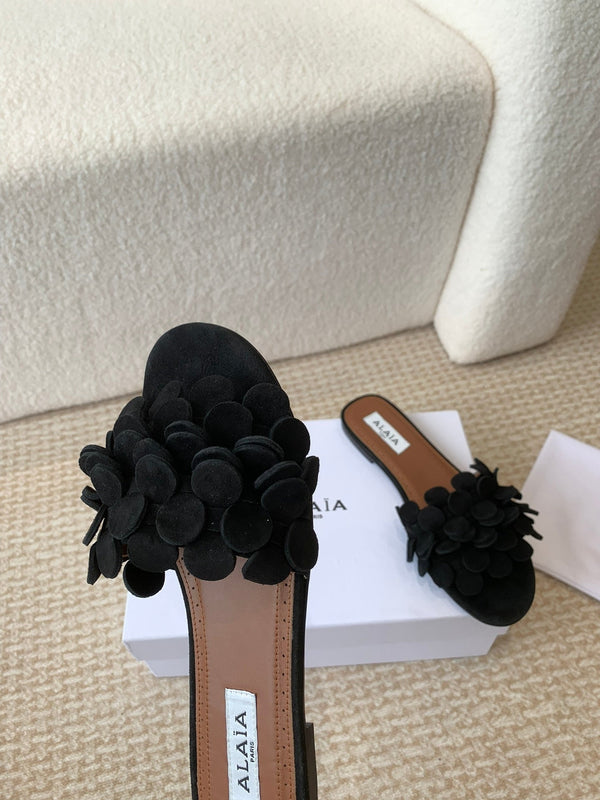 ALAIA FLAT MULE IN BLACK SUEDE
