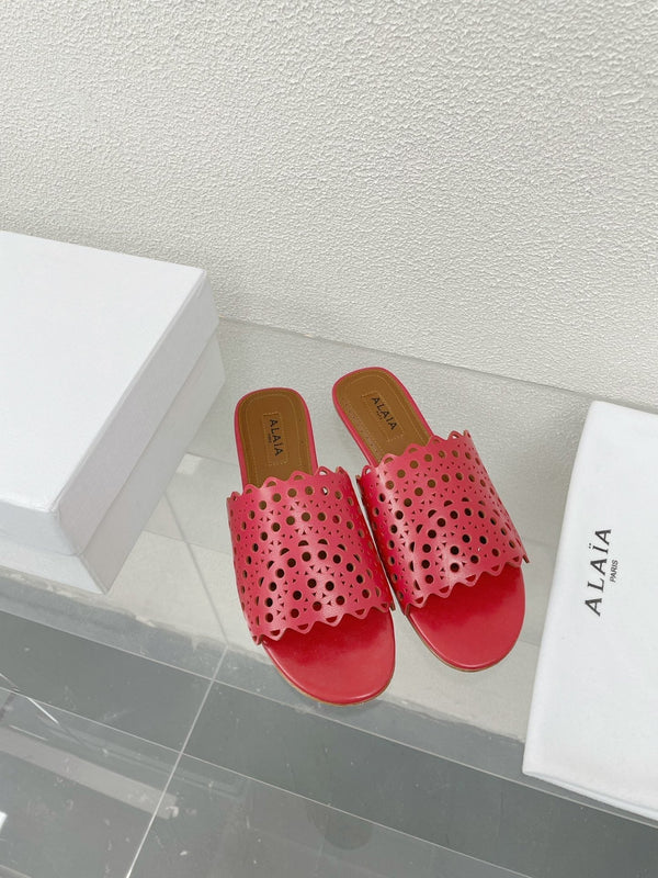 ALAIA VIENNE FLAT MULES IN CHERRY RED LAMBSKIN