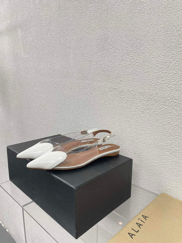ALAIA LE COEUR FLAT SLINGBACKS IN WHITE PATENT LAMBSKIN