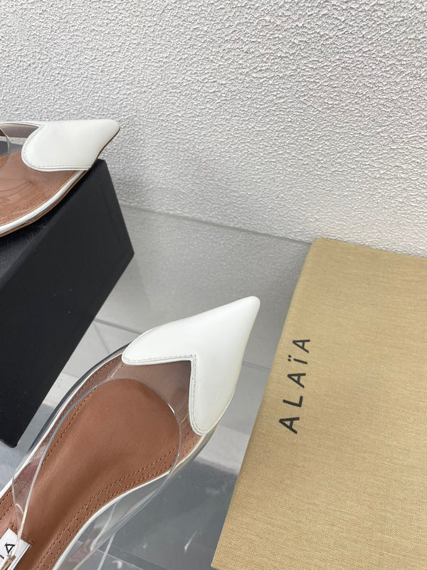 ALAIA LE COEUR FLAT SLINGBACKS IN WHITE PATENT LAMBSKIN