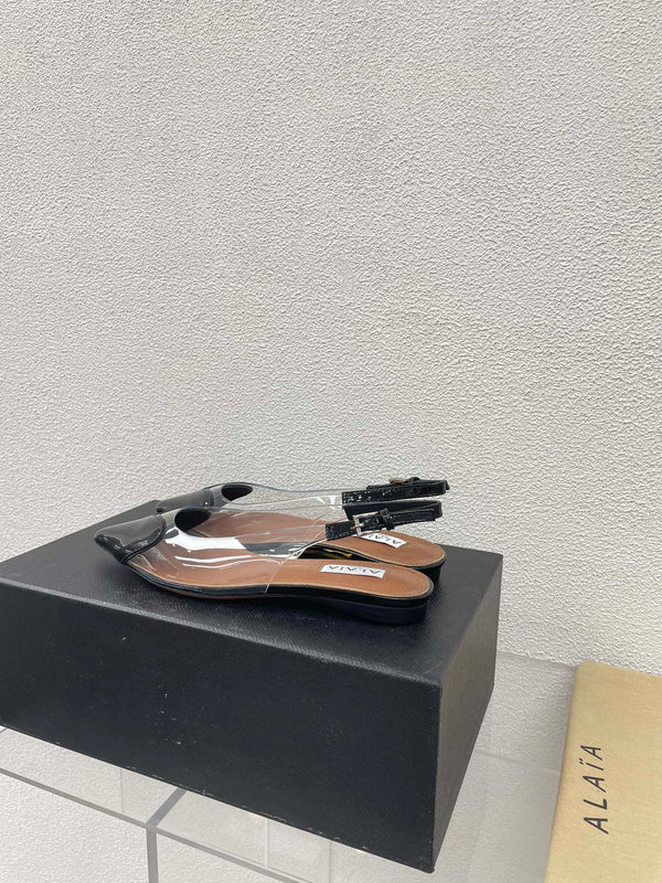 ALAIA LE COEUR FLAT SLINGBACKS IN BLACK PATENT LAMBSKIN