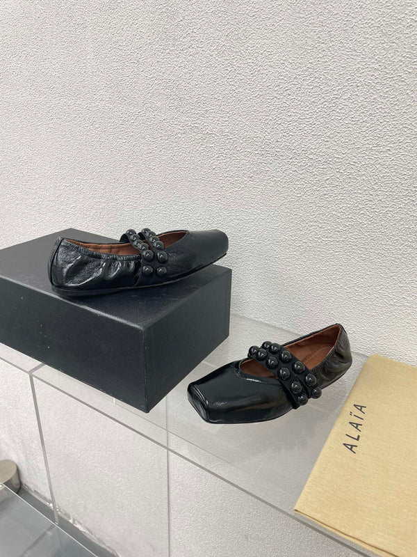 ALAIA MARY JANE PEARL IN GLOSSY BLACK LAMBSKIN