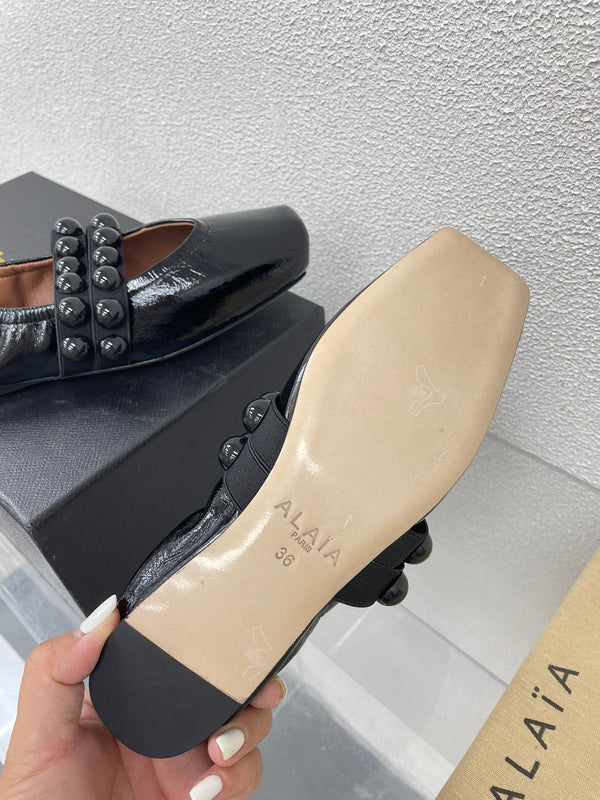 ALAIA MARY JANE PEARL IN GLOSSY BLACK LAMBSKIN