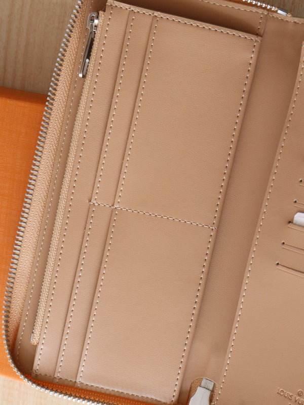 LV Zippy Wallet Vertical Monogram Grained Taurillon Cowhide