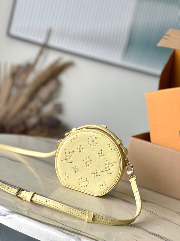 MINI CAPPELLIERA SCATOLA 13 IN PELLE DI VITELLO TRAFORATA CON MONOGRAMMA GIALLO BANANA