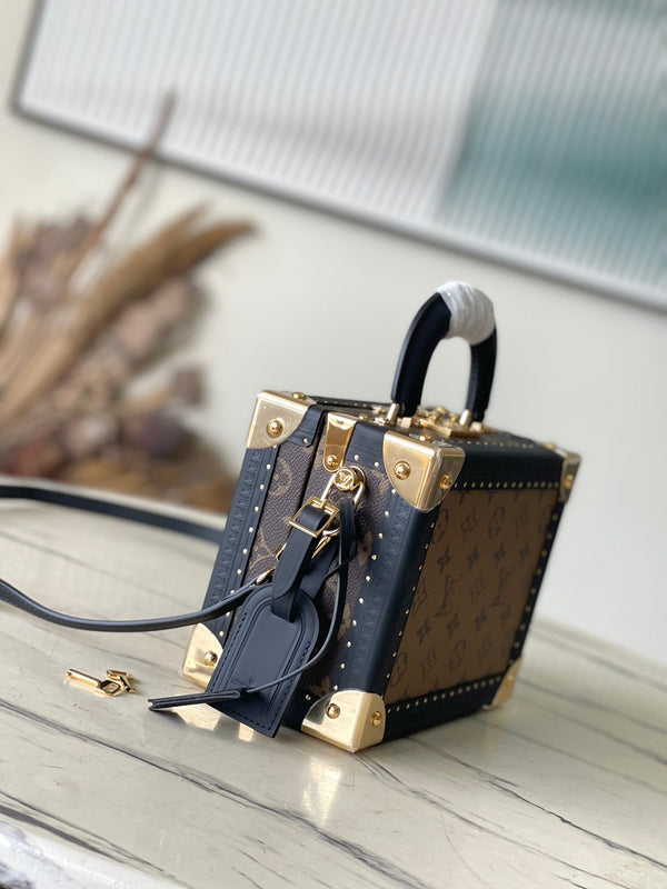 VALIGIA PICCOLA 22 IN TELA RETROMARINA CON MONOGRAMMA E BORDI IN PELLE DI VITELLO NERA, FERRAMENTA ORO