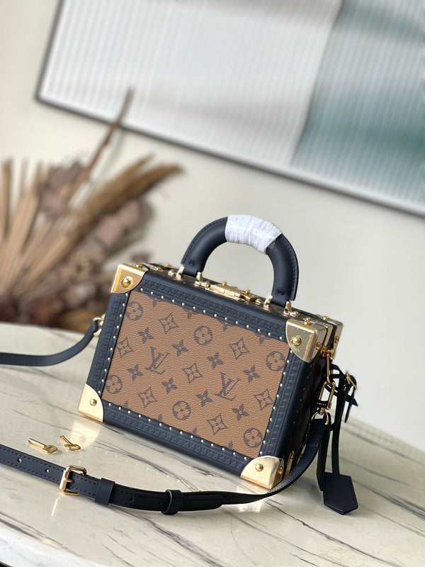 VALIGIA PICCOLA 22 IN TELA RETROMARINA CON MONOGRAMMA E BORDI IN PELLE DI VITELLO NERA, FERRAMENTA ORO