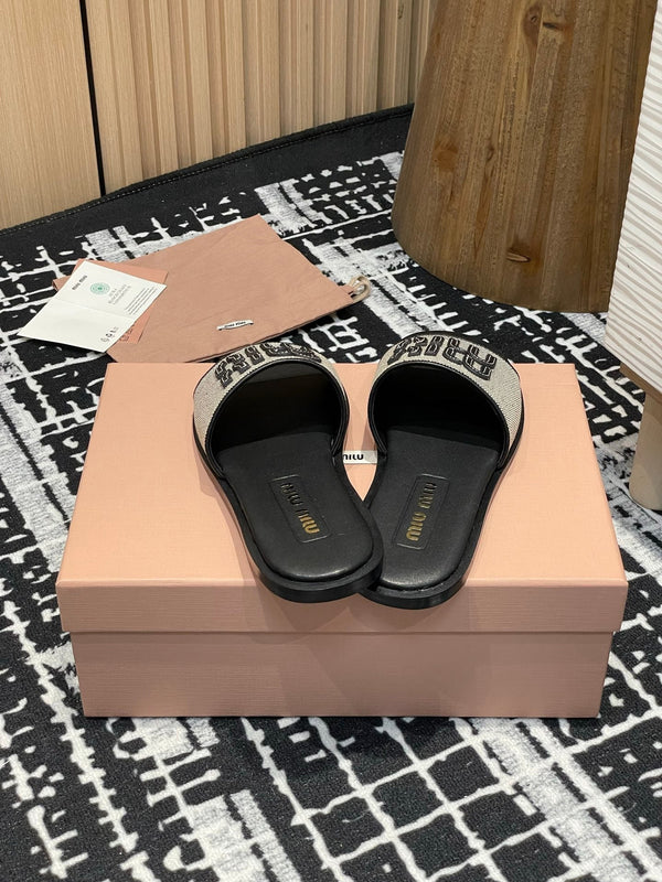 Ciabatte Miu 25S in tela e pelle beige e nera 227133