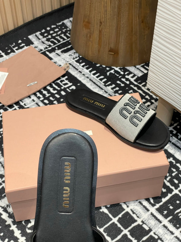 Ciabatte Miu 25S in tela e pelle beige e nera 227133