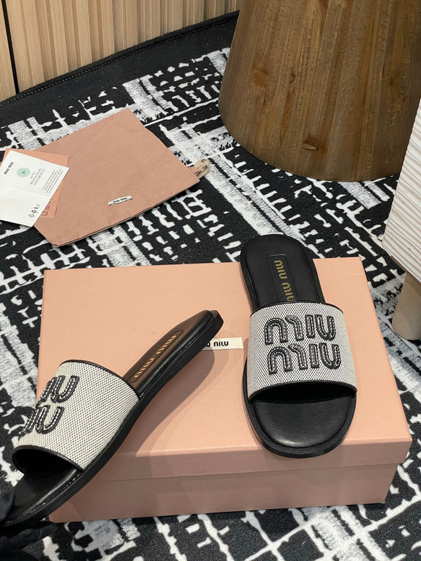 Ciabatte Miu 25S in tela e pelle beige e nera 227133