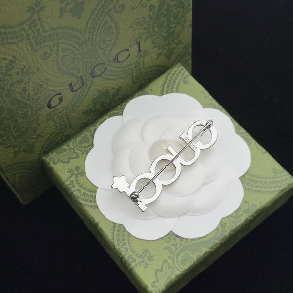 Spilla Gucci in argento 184046