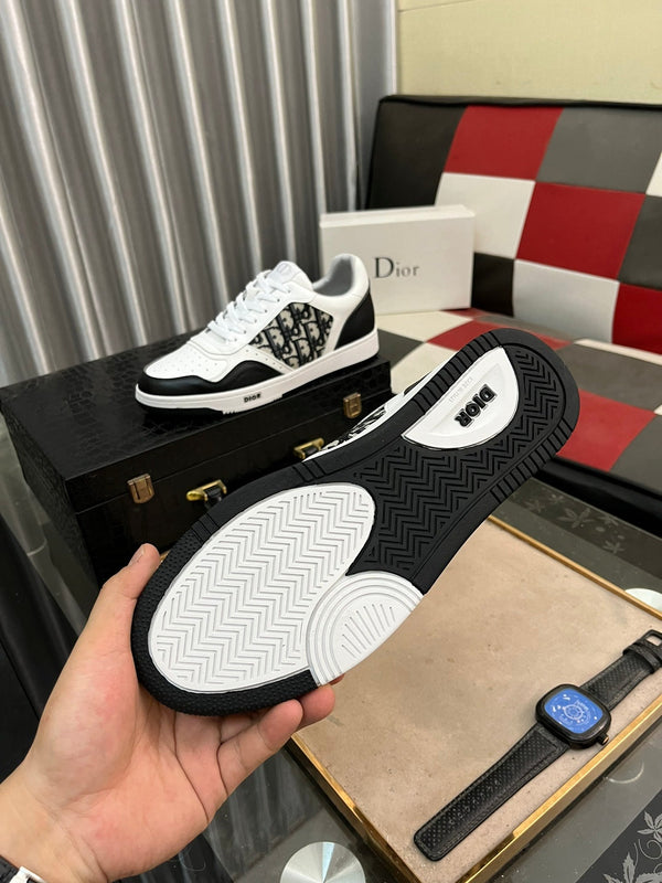 CD B27 SNEAKER BASSA IN PELLE DI VITELLO NERA E BIANCA