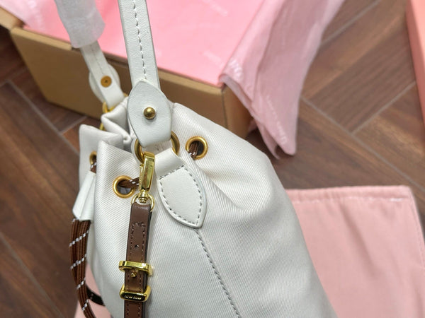 DRAWSTRING BUCKET BAG 21 IN WHITE CANVAS GOLD HARDWARE