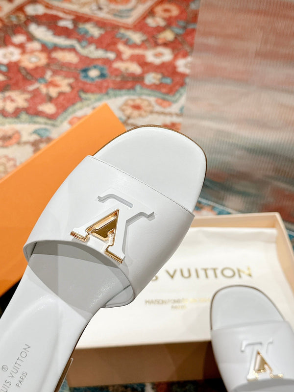 lv capri flat mule white calfskin