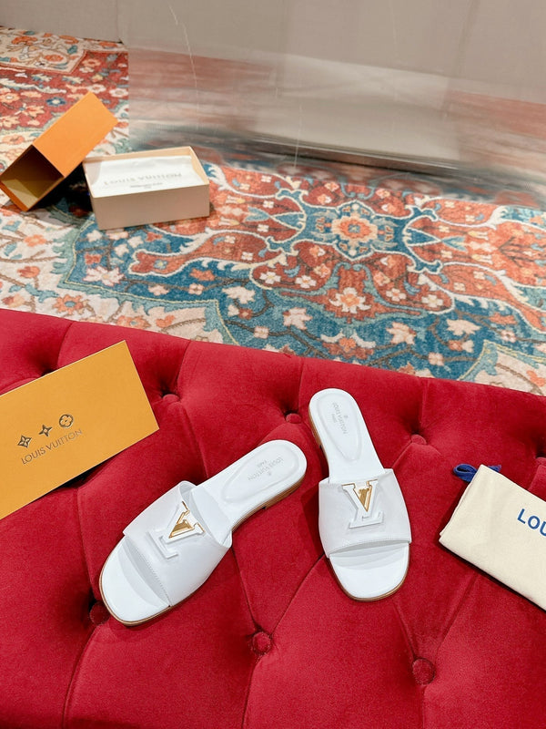 lv capri flat mule white calfskin