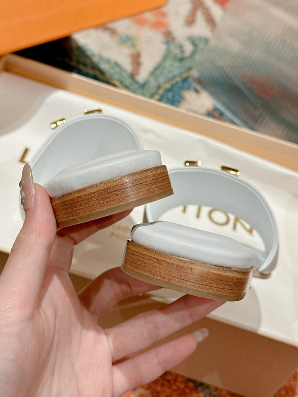 lv capri flat mule white calfskin