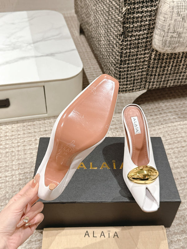 ALAIA SPIKE JEWEL MULES IN WHITE CALFSKIN WITH GOLD HARDWARE