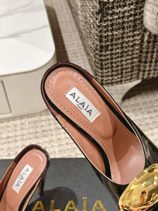 MULES GIOIELLO ALAIA SPIKE IN PELLE DI VITELLO NERA LUCIDA CON FERRAMENTA ORO