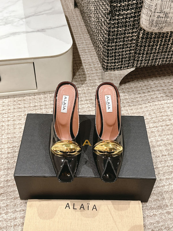 MULES GIOIELLO ALAIA SPIKE IN PELLE DI VITELLO NERA LUCIDA CON FERRAMENTA ORO