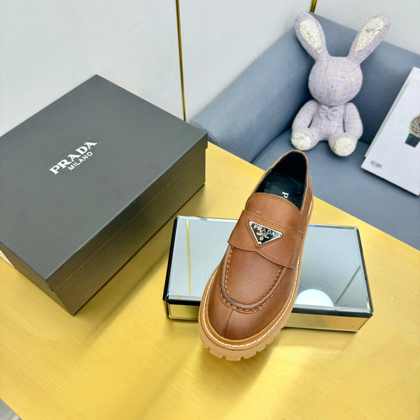 LOAFER WITH TRIANGLE LOGO IN COGNAC CALFSKIN