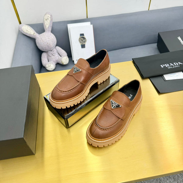LOAFER WITH TRIANGLE LOGO IN COGNAC CALFSKIN