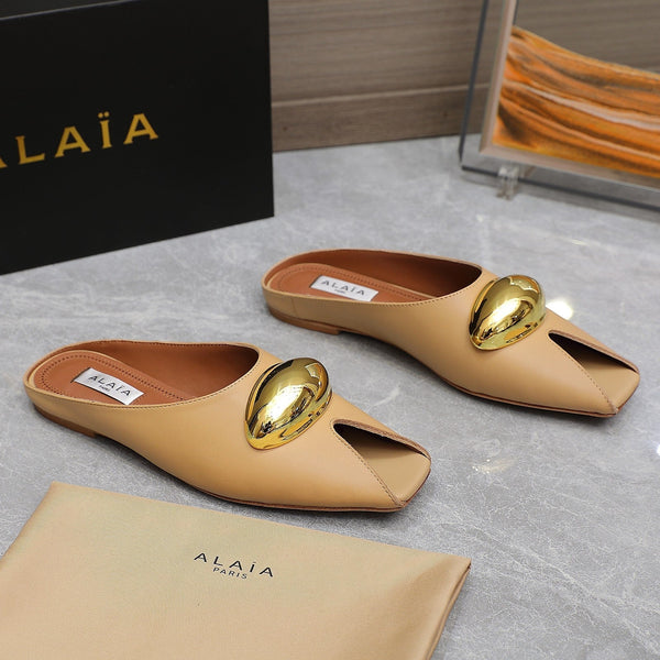 ALAIA FLAT MULE IN SEPIA TAN LAMBSKIN WITH GOLD HARDWARE